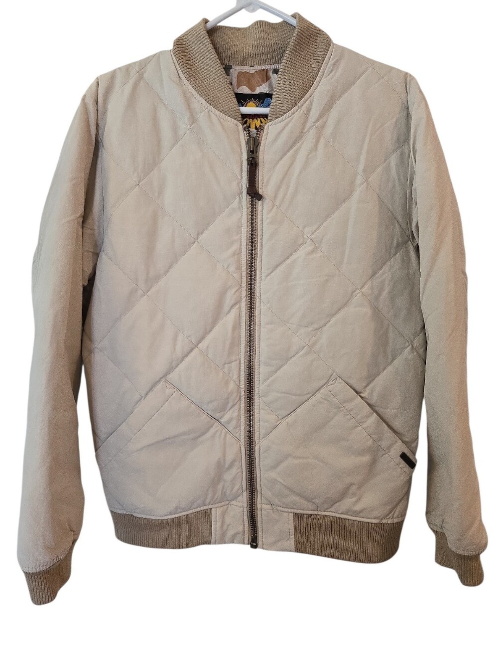 EDDIE BAUER MEN'S 1936 SKYLINER DOWN JACKET. SZ SM. PUMICE BEIGE/ CAMO LINING